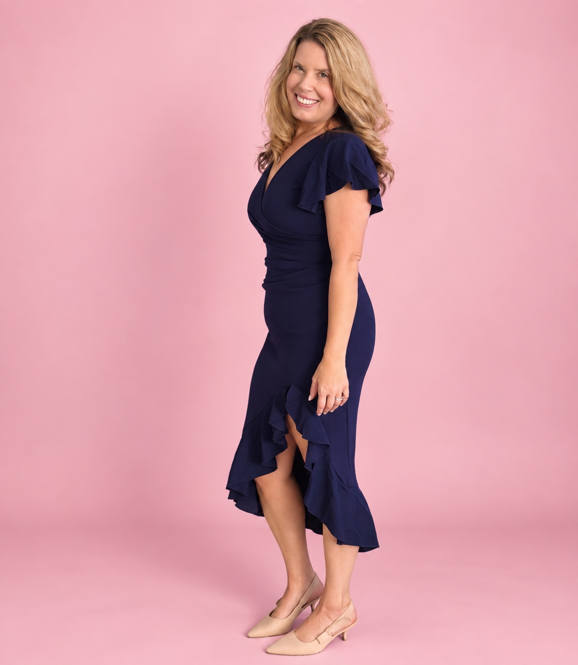 Danielle Foster, President and Founder of D Foster Consulting, wearing her blue dress